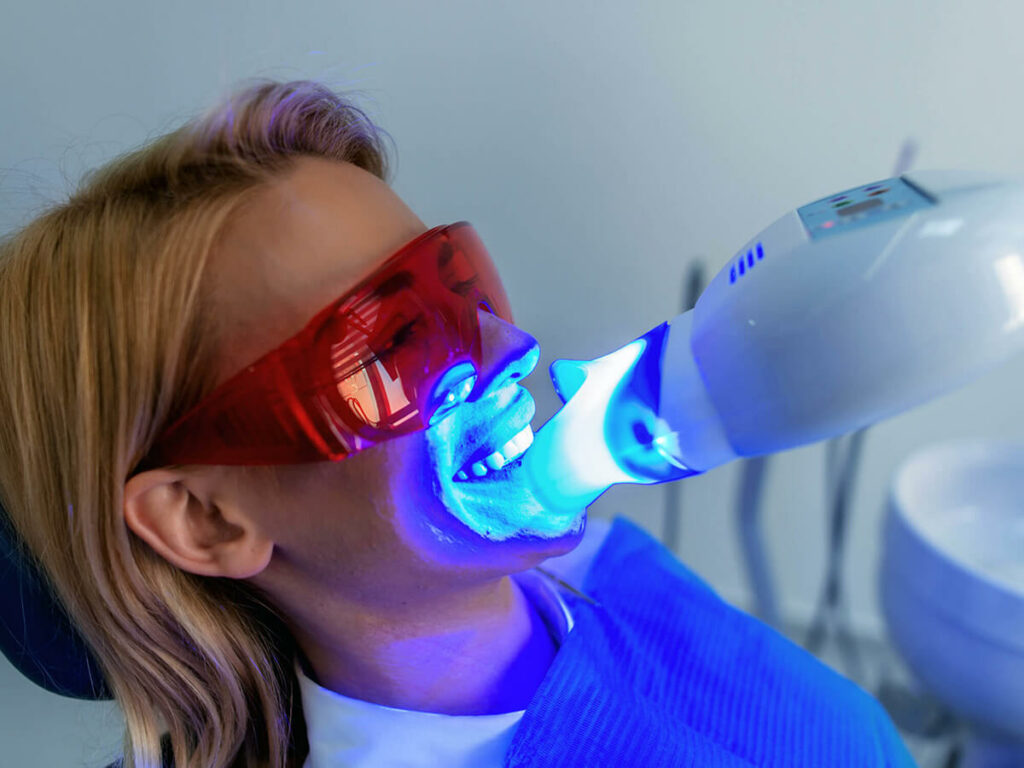 woman getting her teeth professionally whitened